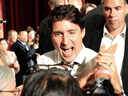 Liberal Leader Justin Trudeau smiles as he greets supporters at a campaign rally in Edmonton, Sept. 12, 2019.