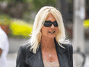 Klara Kozak outside a Toronto court on Sept. 24, 2019. Kozak was part-owner and the public face of a travel firm owned by three police union officials.