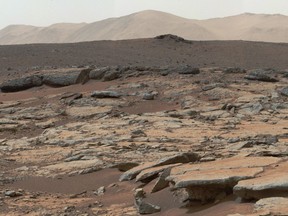 This December 09, 2013, NASA photo is a mosaic of images from NASA's Curiosity Mars rover and shows a series of sedimentary deposits in the Glenelg area of Gale Crater.