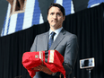 Prime Minister Justin Trudeau holds the final report during the closing ceremony of the National Inquiry into Missing and Murdered Indigenous Women and Girls in Gatineau, Quebec, June 3, 2019.