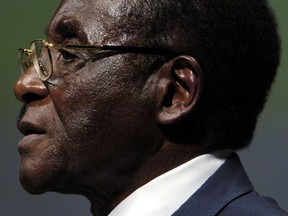 Zimbabwean President Robert Mugabe addresses the Inaugural Session of the World Summit On Information Society in Geneva, Switzerland December 10, 2003.