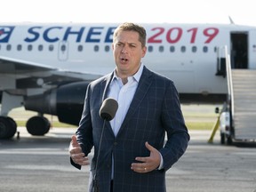 Conservative Leader Andrew Scheer talks with reporters prior to boarding his campaign plane in Ottawa on Wednesday, September 11, 2019.