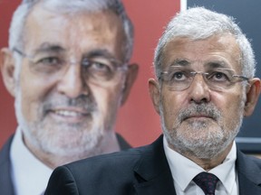 Imam Hassan Guillet, who has been dropped by the Liberal party as a candidate, listens to a question during a news conference in Montreal on Wednesday, September 4, 2019.