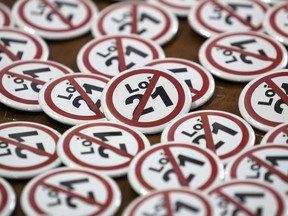 Badges are seen as part of a campaign in opposition to Quebec's secularism Bill 21 during a news conference in Montreal on Thursday, Sept. 5, 2019.