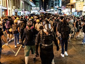 Protesters prepare to clash with police outside the Mongkok Police Station on September 6, 2019 in Hong Kong, China.