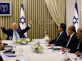 Memebers of the  Joint List party sits next to Israeli President Reuven Rivlin as he began talks with political parties over who should form a new government, at his residence in Jerusalem September 22, 2019.