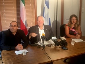 Toufik Benhamiche, left to right, Bloc Quebecois MP Luc Theriault and Kahina Bensaadi, Toufik's wife, answer reporters questions in Mascouche, Que., Friday, Sept. 6, 2019. Benhamiche returned to Canada on Saturday after being caught it legal limbo in Cuba since a boating accident in July 2017 that killed a fellow Canadian tourist during an excursion.