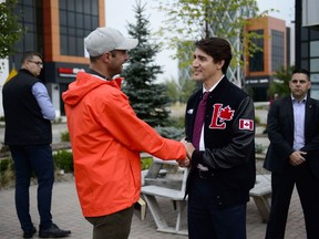 Liberal Leader Justin Trudeau talks to a voter in Kitchener, Ont., on Monday, Sept. 16, 2019.