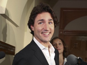 Justin Trudeau walks past the media before the Liberal Caucus at Parliament Hill September 26, 2012, in Ottawa, Ontario.