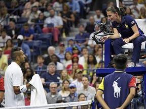 Nick Kyrgios of Australia talks with the chair umpire in a third round match against Andrey Rublev of Russia at the 2019 U.S. Open tennis tournament.