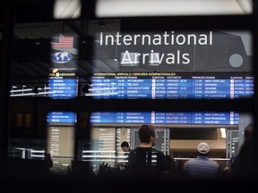 Flight arrival information is displayed on a screen at Toronto Pearson International Airport (YYZ) in Toronto, Ontario, Canada, on Monday, July 22, 2019.