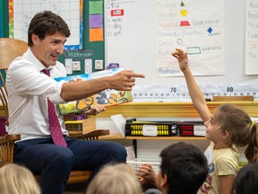 Elona Ibraheem, 7, tries to answer a question as Liberal Leader Justin Trudeau visits with pupils at Blessed Sacrament Catholic Elementary School in London, Ont., on  Sept. 16, 2019.