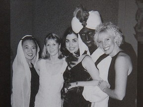 A photo posted online by Time with the following caption "Justin Trudeau, now the prime minister of Canada, appears in dark makeup on his face, neck and hands at a 2001 "Arabian Nights"-themed party at the West Point Grey Academy, the private school where he taught."