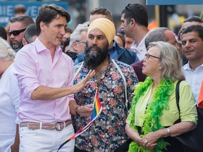 Prime Minister Justin Trudeau attends the annual pride parade in Montreal with NDP Leader Jagmeet Singh and Green Party Leader Elizabeth May on Aug. 18, 2019.