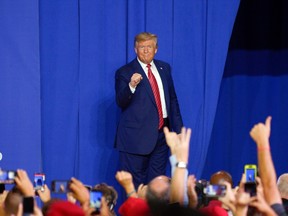U.S. President Donald Trump gestures as he stands on stage during an event at Pratt Industries in Wapakoneta, Ohio, U.S., on Sunday, Sept. 22, 2019. Trump escalated attacks on his main Democratic rival Sunday even as he faced continued questions over his discussions with Ukraine’s president about Joe Biden.