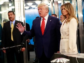 U.S. President Donald Trump speaks with reporters as he and first lady Melania Trump arrive for the 74th session of the United Nations General Assembly at U.N. headquarters in New York City, New York, U.S., September 24, 2019.