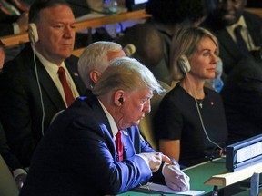 US President Donald Trump checks his watch at the UN Climate Action Summit on September 23, 2019 in New York City.