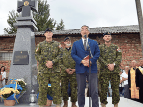 Roman Waschuk, Canada’s Ambassador to Ukraine, along with members of the Canadian Forces honour members of the Organization of Ukrainian Nationalists and the Ukrainian Insurgent Army.