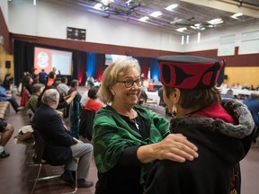 Green Party Leader Elizabeth May, left, and NDP candidate for Central Okanagan-Similkameen-Nicola, and wife of Grand Chief Stewart Phillip, Joan Phillip, greet each other before speaking at the B.C. Assembly of First Nations annual general meeting at the Musqueam First Nation, in Vancouver on Thursday, Sept. 19, 2019.