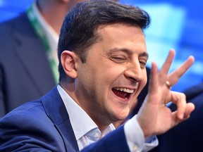 Volodymyr Zelensky reacts after the announcement of the first exit poll results in Ukraine's presidential election on April 21, 2019.