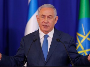 Israeli Prime Minister Benjamin Netanyahu gestures as he speaks during a press conference in Jerusalem on September 1, 2019.