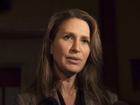 Ontario Francophone Affairs Minister Caroline Mulroney speaks to reporters following an early morning PC Caucus meeting at the Ontario Legislature in Toronto on Thursday, November 29, 2018.