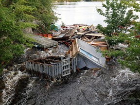 A fishing shed is caught in a river after the departure of Hurricane Dorian in Halifax, Nova Scotia, Canada September 8, 2019.