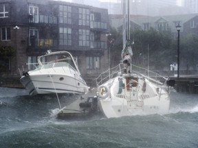 Pleasure boats take a beating along the waterfront in Halifax as hurricane Dorian approaches on Saturday, Sept. 7, 2019. A team at Memorial University says it recorded a 100-foot wave off the southwestern coast of Newfoundland during the tail end of post-tropical storm Dorian.