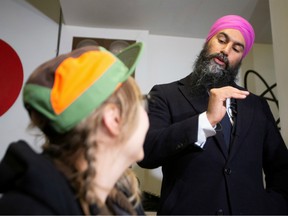 New Democratic Party (NDP) leader Jagmeet Singh talks to patrons in a cafe during an election campaign visit in Montreal, Quebec, Canada October 16, 2019.