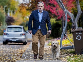 André Pratte walks his dog, Philomène, near their home in St-Lambert, south of Montreal, on Wednesday, Oct. 23, 2019. Pratte resigned from the Senate on Monday, Oct. 21.