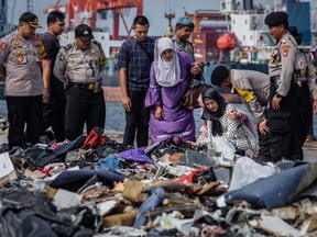 Families of the victims of Lion Air flight JT 610, visit an operations centre to look for personal items of their relatives, at the Tanjung Priok port on October 31, 2018 in Jakarta, Indonesia.