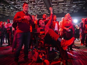 Supporters of Liberal party candidate, Justin Trudeau, react to the announcements of the first results at the Palais des Congres in Montreal during Team Justin Trudeau 2019 election night event in Montreal, Canada on October 21, 2019.