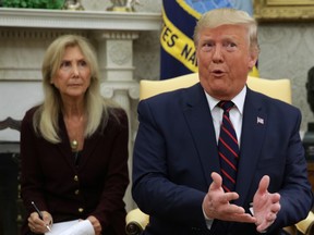 U.S. President Donald Trump speaks to members of the media as he meets with President Sergio Mattarella of Italy in the Oval Office of the White House October 16, 2019 in Washington, D.C.