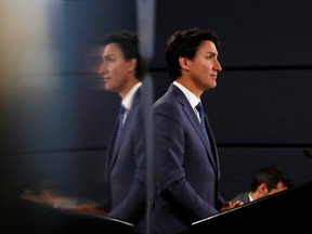 Canada's Prime Minister Justin Trudeau speaks to the news media for the first time since winning a minority government in the federal election, at the National Press Theatre in Ottawa, Ontario, Canada October 23, 2019.