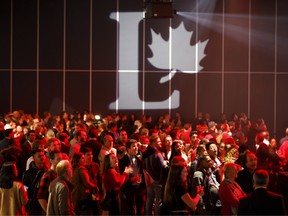 Liberal supporters react as they watch results roll in at Canadian Prime Minister Justin Trudeau's election night headquarters on October 21, 2019 in Montreal, Canada.