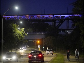 In this Aug. 31, 2019 photo, the High Level Bridge is seen lit up in purple to commemorate International Overdose Awareness Day. (PHOTO BY LARRY WONG/POSTMEDIA)