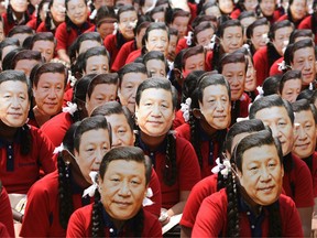 Indian school students wear masks of China's President Xi Jinping in Chennai on October 10, 2019, ahead of a summit with his Indian counterpart Narendra Modi.