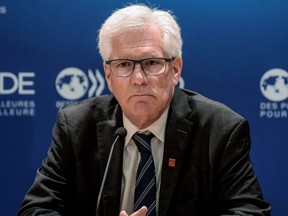 Minister for International Trade Diversification Jim Carr addresses a press conference at the OECD headquarters following a WTO reform meeting in Paris on May 23, 2019 as part of the OECD Forum annual meeting.