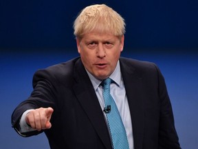 Britain's Prime Minister Boris Johnson delivers his keynote speech to delegates on the final day of the annual Conservative Party conference at the Manchester Central convention complex, in Manchester, north-west England on October 2, 2019.