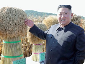 North Korean leader Kim Jong Un inspects the output at Farm No. 1116 at an undisclosed location in a news photo released by the Korean Central News Agency on October 9, 2019.
