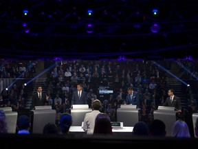 Liberal leader Justin Trudeau, second left, speaks as Green Party leader Elizabeth May, left to right, Conservative leader Andrew Scheer, People's Party of Canada leader Maxime Bernier, Bloc Quebecois leader Yves-Francois Blanchet and NDP leader Jagmeet Singh look on during the Federal leaders debate in Gatineau, Que. Monday, October 7, 2019.