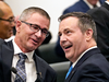 Alberta Finance Minister Travis Toews, left, speaks with Alberta Premier Jason Kenney after Toews delivered his budget speech at the Alberta Legislature in Edmonton on Oct. 24, 2019.