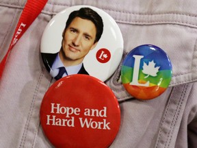 A volunteer wears buttons during a rally for Liberal Leader Justin Trudeau in Peterborough, Ont., on Sept. 26, 2019.