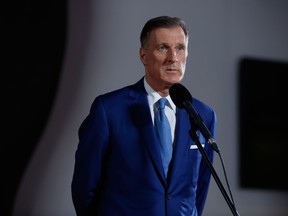 Maxime Bernier, leader of the People's Party of Canada, listens to members of the media following the federal leader's debate in Gatineau, Quebec.