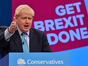 Britain's Prime Minister Boris Johnson delivers his keynote speech to delegates on the final day of the annual Conservative Party conference at the Manchester Central convention complex, in Manchester, north-west England on October 2, 2019.