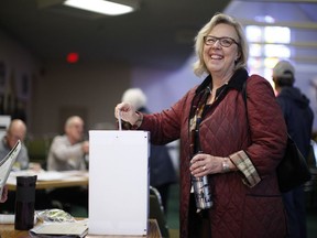 Green Party Leader Elizabeth May casts her vote at St. Elizabeth's Parish while in Sidney, B.C., on Monday, Oct. 21, 2019.