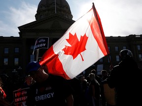 Pro-oil counter-protesters respond to a climate-change march at the Alberta Legislature in Edmonton on Oct. 18, 2019.