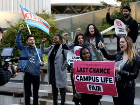 Students protest outside court before a hearing in Toronto on Friday, Oct. 11, 2019. The students are challenging the Ontario government's "student choice initiative," which makes certain supplementary fees optional.