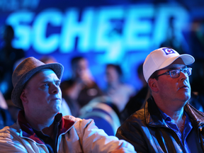 Supporters of Conservative leader Andrew Scheer watch voting results during an election night rally in Regina, Sask., on Oct. 21, 2019.
