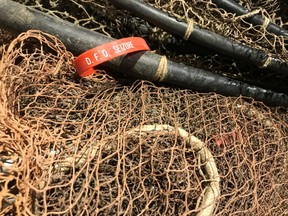 A department of Fisheries and Oceans seizure tag is seen on eel netting belonging to Donald Marshall Jr. in an undated handout photo. The recovery of eel nets that helped recast Aboriginal rights to earn a living from fishing is bringing back powerful memories for those touched by their story.